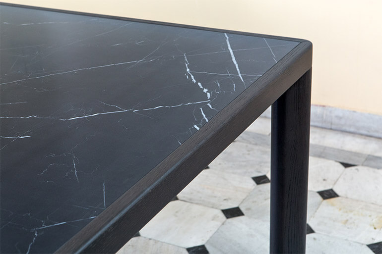 Detail of the ka-bera B table in dark oak and ceramic. al2, art for living