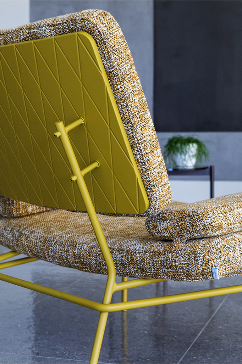 Detail of the lip armchair in mustard yellow back and fabric. al2, art for living